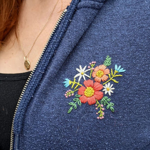Embroidered floral pattern on hooded sweatshirt